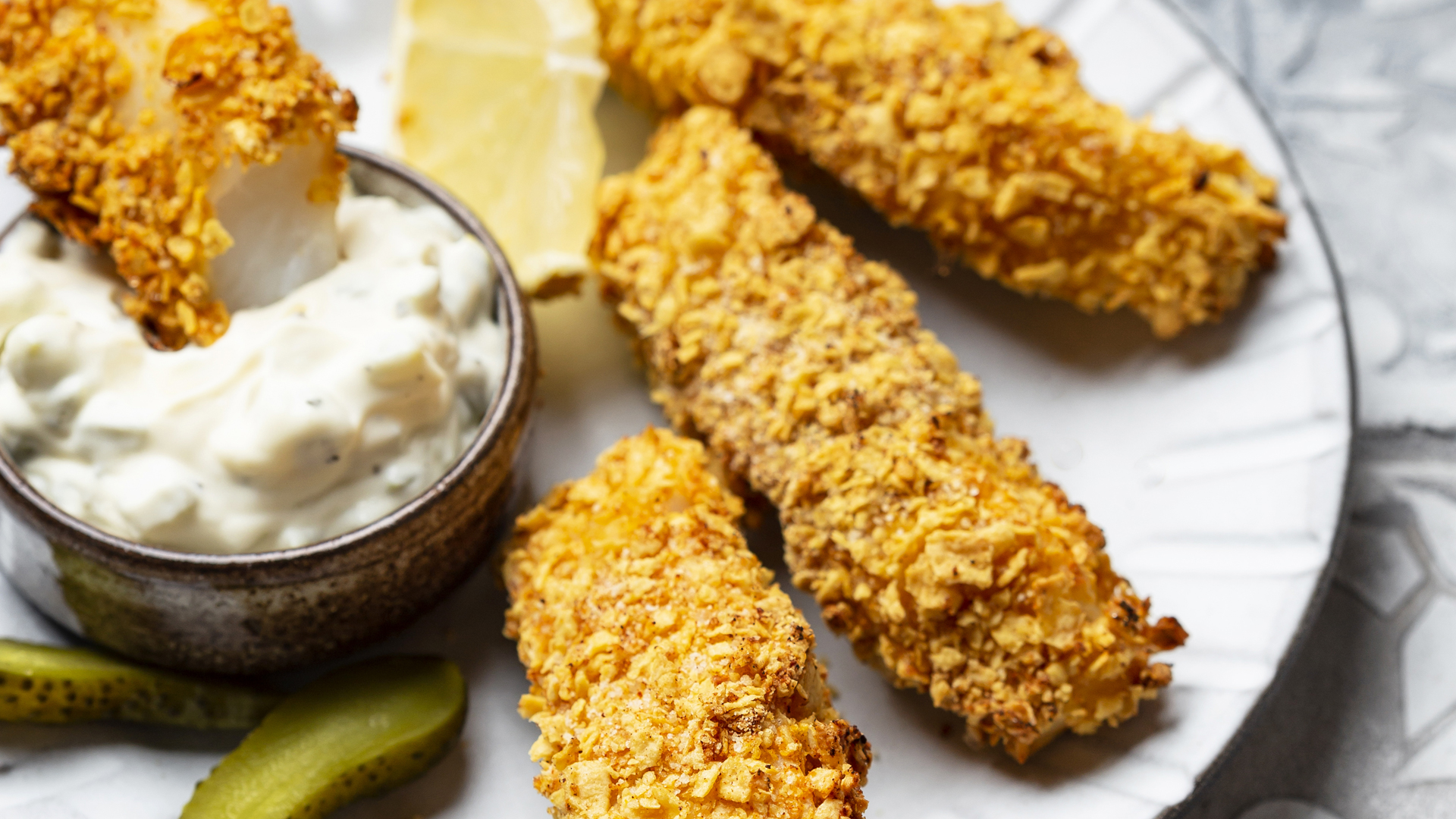 Kids who need to eat gluten-free will love these crumbed fish fingers served with homemade vegetable chips.