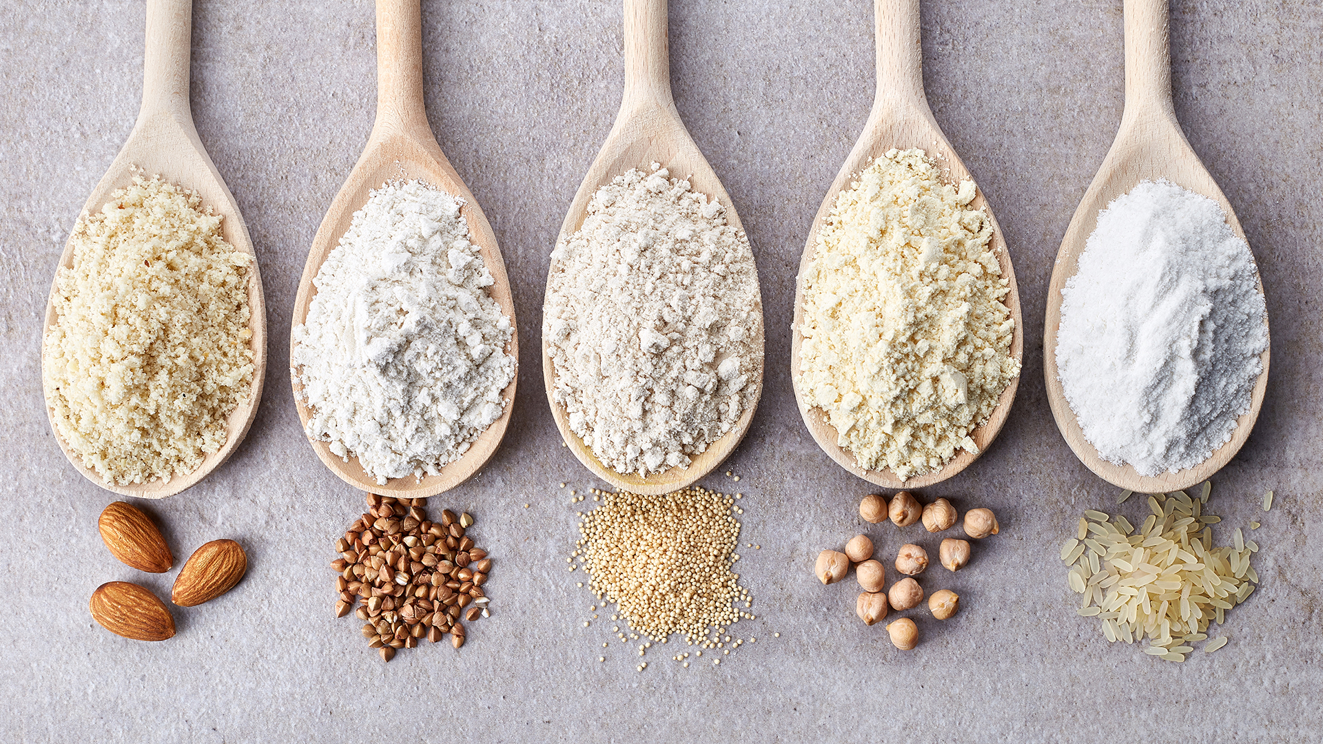 Spoonfuls of gluten-free flours: each have a unique flavour profile and perform differently.
